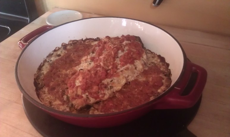 ricotta anchovy, raisin and walnut  stuffed eggplant